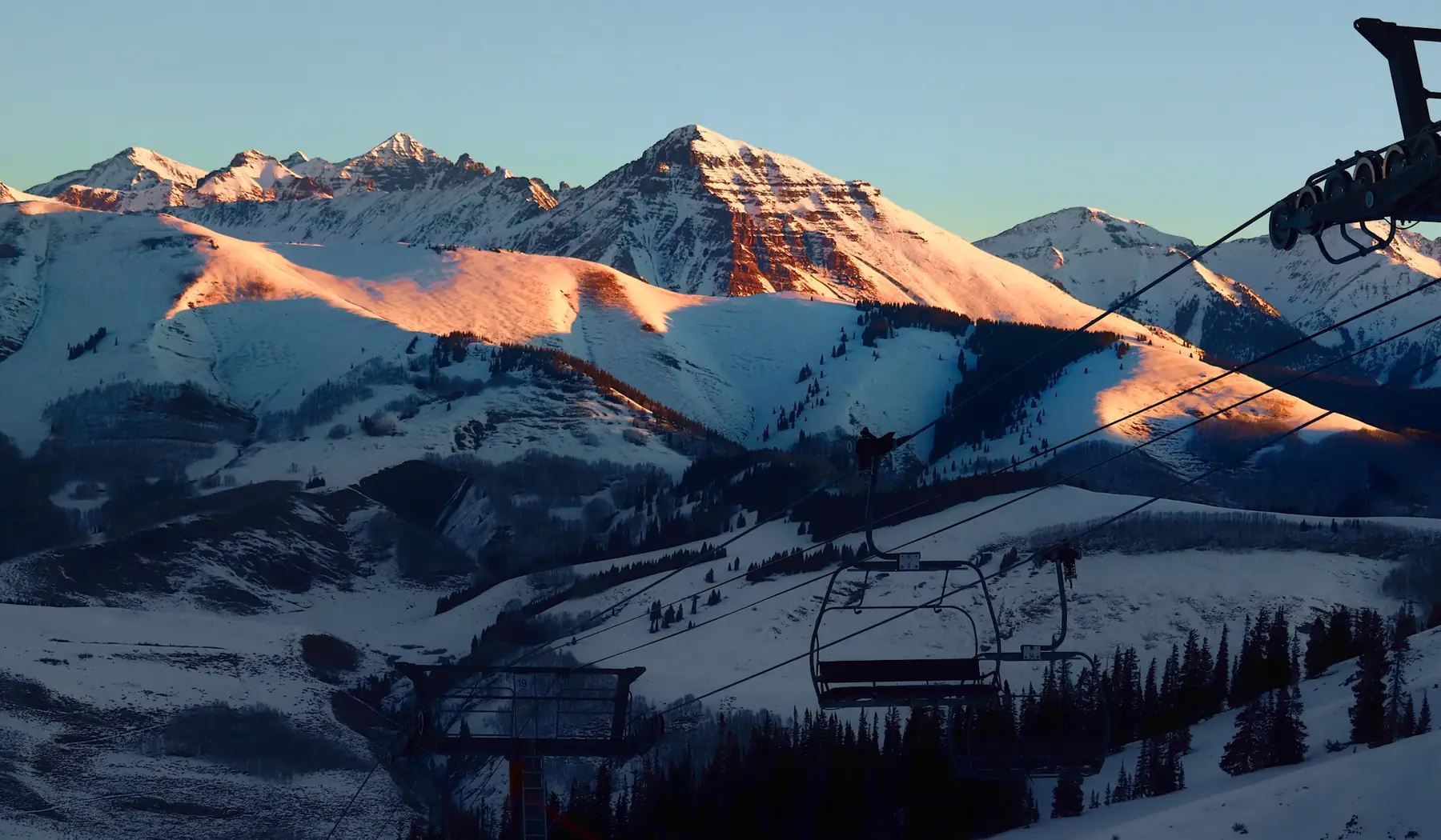 Homes beneath Colorado foothills at blue hour